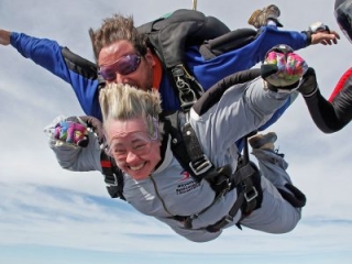 Houston mayor Annise Parker skydiving with instructor Hank Prewitt and Helaine Rumaner