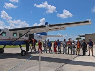 Skydivers boarding the Super Caravan at Skydive Spaceland Florida