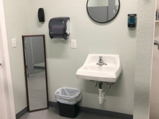 The air-conditioned packing room at Skydive Spaceland Florida has adjacent men's and women's restrooms including showers.
